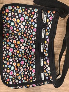 LeSportsac Black Crossbody with Multicolor Heart Print- no wear! Like new.